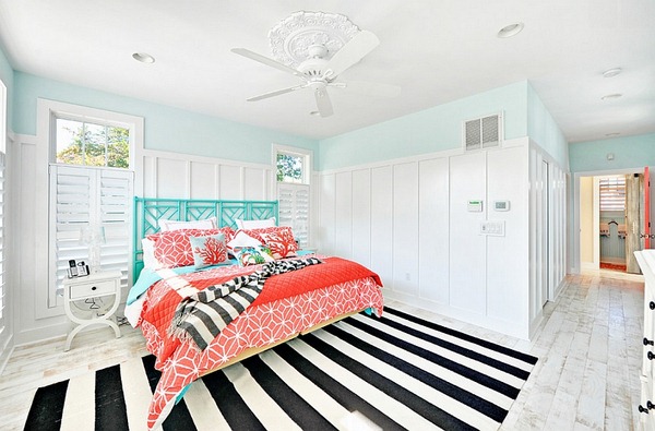 Beach-style-bedroom-with-a-striped-rug-and-fabulous-coral-and-aqua-accents
